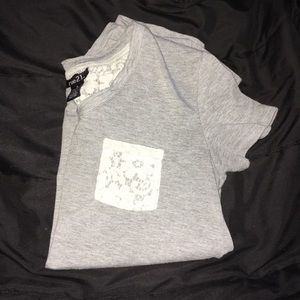 Cute low high tee with crochet pocket